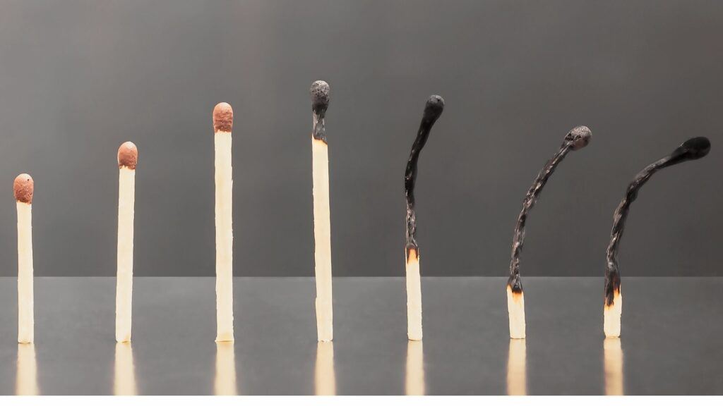 Matchsticks representing human evolution with the most recent matchsticks burnt