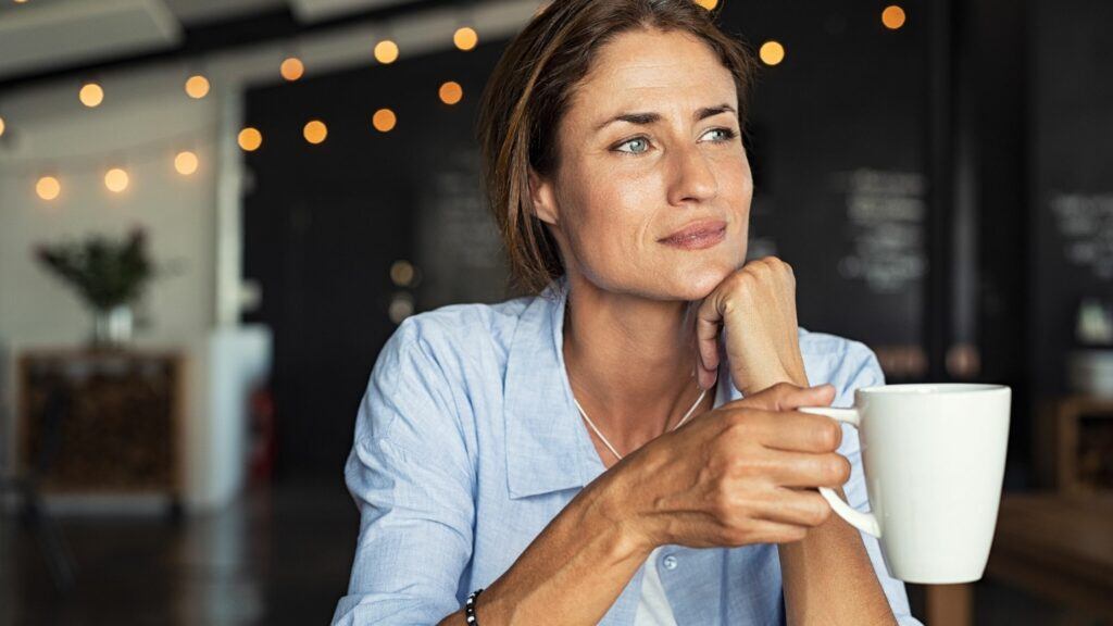 A stunning women enjoying a cup of coffee
